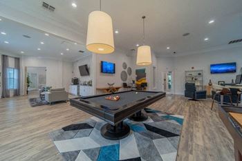a pool table in the center of a living room
